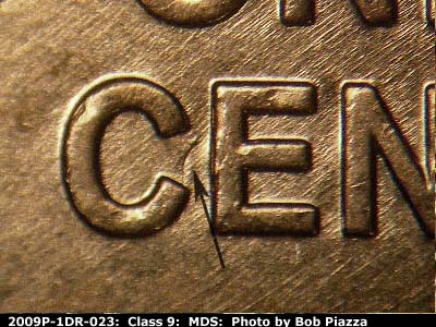 Die-stage B marker on 2009P•1DR•023 (2009 Doubled Die Reverse).