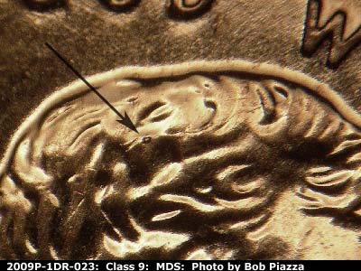 Die-stage B marker on 2009P•1DR•023 (2009 Doubled Die Reverse).