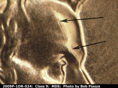 Die-stage B marker on 2009P•1DR•024 (2009 Doubled Die Reverse).