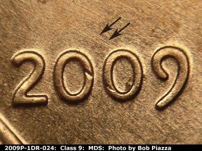 Die-stage B marker on 2009P•1DR•024 (2009 Doubled Die Reverse).