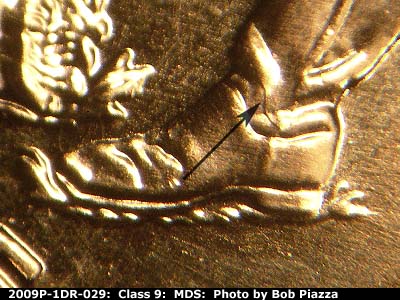 Die-stage B marker on 2009P•1DR•029 (2009 Doubled Die Reverse).