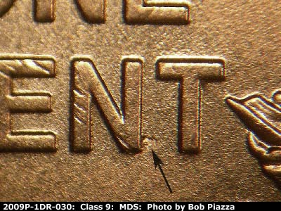 Die-stage B marker on 2009P•1DR•030 (2009 Doubled Die Reverse).