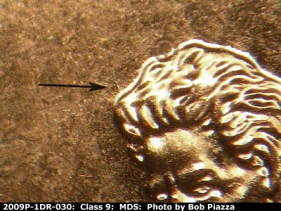 Die-stage B marker on 2009P•1DR•030 (2009 Doubled Die Reverse).