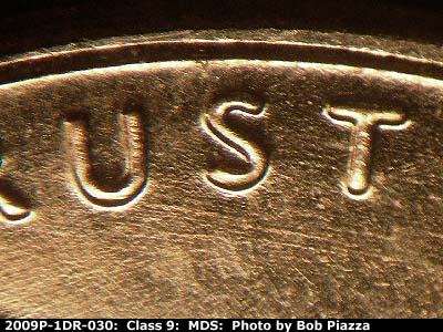 Die-stage B marker on 2009P•1DR•030 (2009 Doubled Die Reverse).