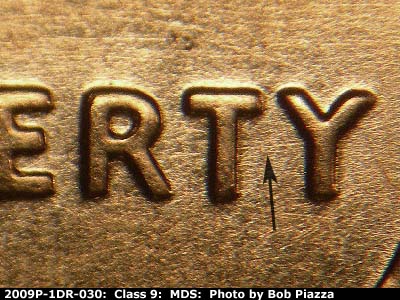 Die-stage B marker on 2009P•1DR•030 (2009 Doubled Die Reverse).
