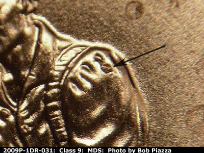 Die-stage B marker on 2009P•1DR•031 (2009 Doubled Die Reverse).
