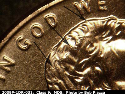 Die-stage B marker on 2009P•1DR•031 (2009 Doubled Die Reverse).