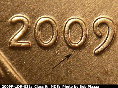 Die-stage B marker on 2009P•1DR•031 (2009 Doubled Die Reverse).