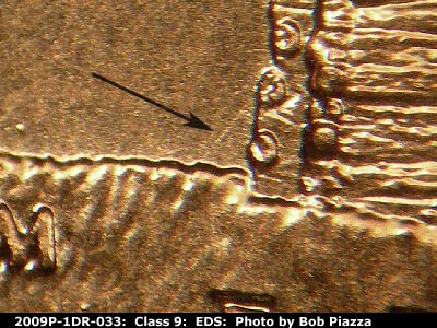 Die-stage A marker on 2009P•1DR•033 (2009 Doubled Die Reverse).