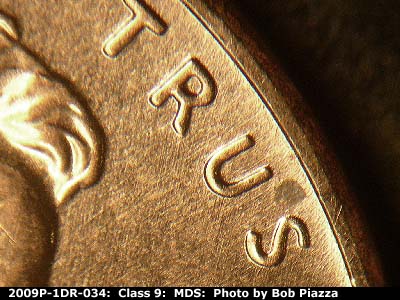 Die-stage B marker on 2009P•1DR•034 (2009 Doubled Die Reverse).