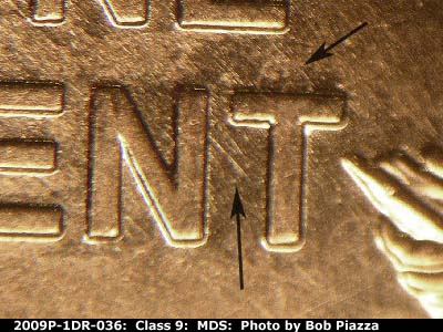 Die-stage B marker on 2009P•1DR•036 (2009 Doubled Die Reverse).