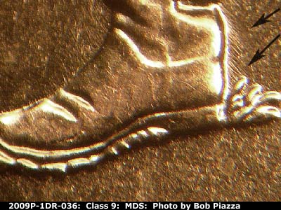 Die-stage B marker on 2009P•1DR•036 (2009 Doubled Die Reverse).