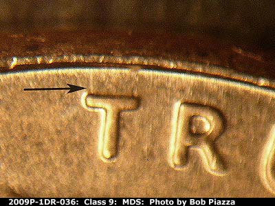 Die-stage B marker on 2009P•1DR•036 (2009 Doubled Die Reverse).