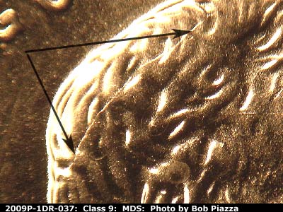Die-stage B marker on 2009P•1DR•037 (2009 Doubled Die Reverse).