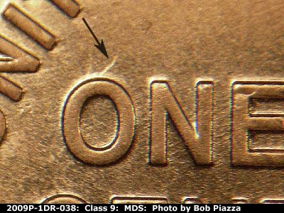 Die-stage B marker on 2009P•1DR•038 (2009 Doubled Die Reverse).