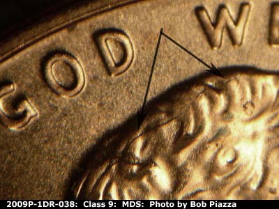 Die-stage B marker on 2009P•1DR•038 (2009 Doubled Die Reverse).