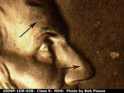 Die-stage B marker on 2009P•1DR•038 (2009 Doubled Die Reverse).