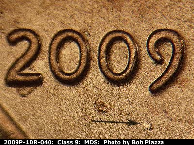 Die-stage B marker on 2009P•1DR•040 (2009 Doubled Die Reverse).