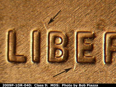 Die-stage B marker on 2009P•1DR•040 (2009 Doubled Die Reverse).