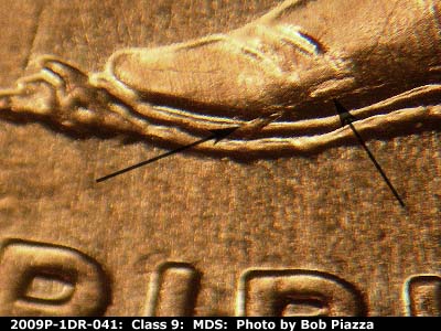 Die-stage B marker on 2009P•1DR•041 (2009 Doubled Die Reverse).