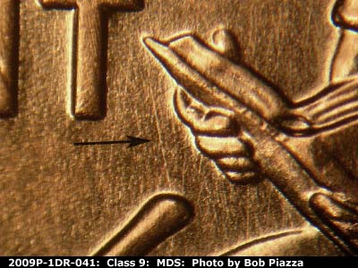 Die-stage B marker on 2009P•1DR•041 (2009 Doubled Die Reverse).