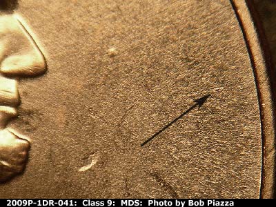 Die-stage B marker on 2009P•1DR•041 (2009 Doubled Die Reverse).