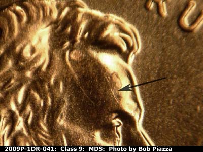 Die-stage B marker on 2009P•1DR•041 (2009 Doubled Die Reverse).