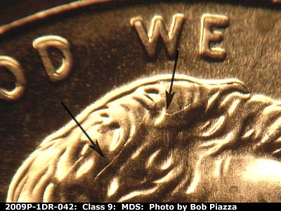 Die-stage B marker on 2009P•1DR•042 (2009 Doubled Die Reverse).