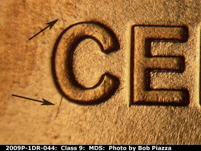 Die-stage B marker on 2009P•1DR•044 (2009 Doubled Die Reverse).