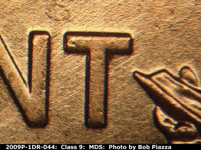 Die-stage B marker on 2009P•1DR•044 (2009 Doubled Die Reverse).