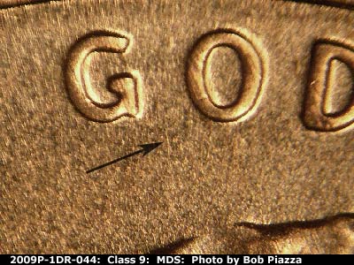 Die-stage B marker on 2009P•1DR•044 (2009 Doubled Die Reverse).