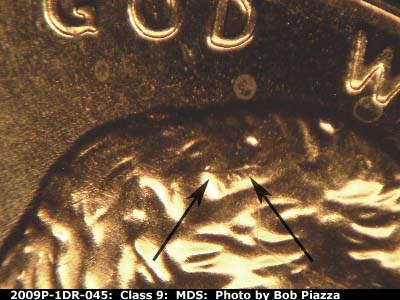 Die-stage B marker on 2009P•1DR•045 (2009 Doubled Die Reverse).