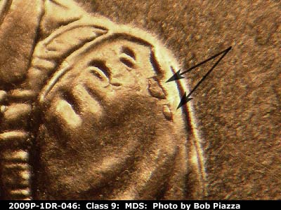 Die-stage B marker on 2009P•1DR•046 (2009 Doubled Die Reverse).