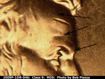 Die-stage B marker on 2009P•1DR•046 (2009 Doubled Die Reverse).