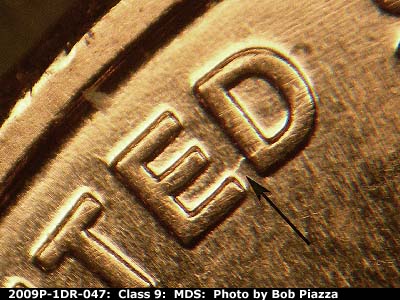 Die-stage B marker on 2009P•1DR•047 (2009 Doubled Die Reverse).