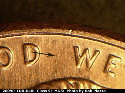Die-stage B marker on 2009P•1DR•048 (2009 Doubled Die Reverse).
