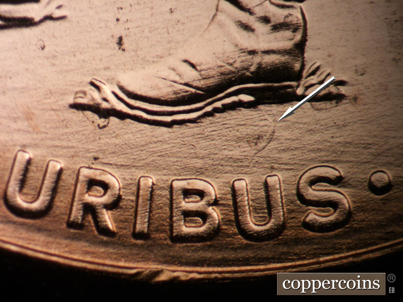 Die-stage B marker on 2009P•1DR•050 (2009 Doubled Die Reverse).