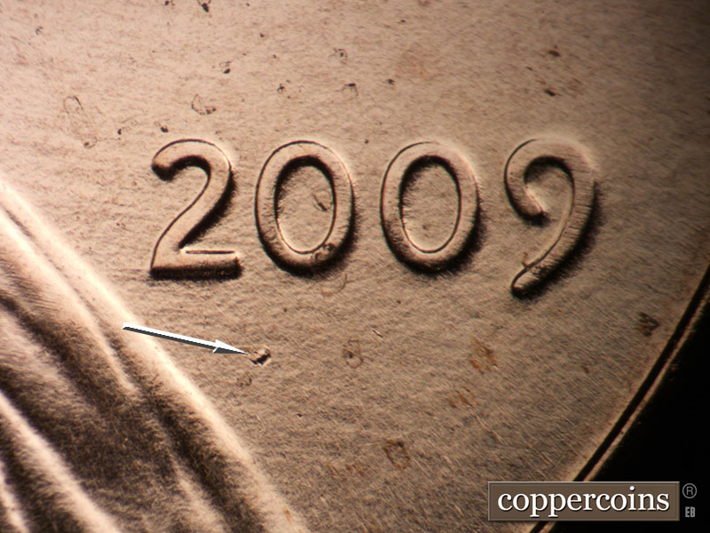 Die-stage B marker on 2009P•1DR•050 (2009 Doubled Die Reverse).