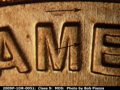 Die-stage B marker on 2009P•1DR•051 (2009 Doubled Die Reverse).