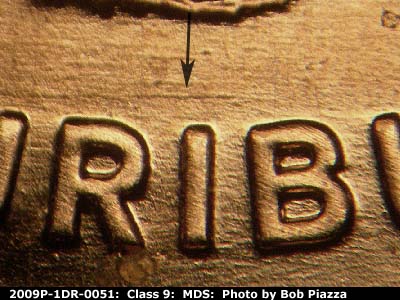 Die-stage B marker on 2009P•1DR•051 (2009 Doubled Die Reverse).