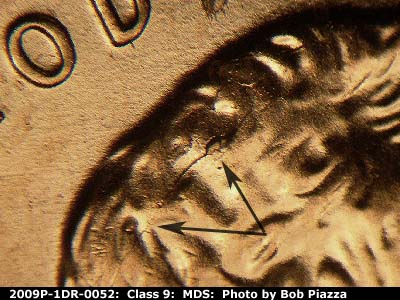 Die-stage B marker on 2009P•1DR•052 (2009 Doubled Die Reverse).