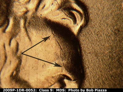 Die-stage B marker on 2009P•1DR•052 (2009 Doubled Die Reverse).