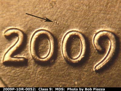 Die-stage B marker on 2009P•1DR•052 (2009 Doubled Die Reverse).