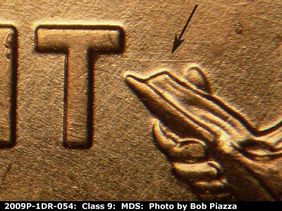 Die-stage B marker on 2009P•1DR•054 (2009 Doubled Die Reverse).