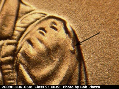 Die-stage B marker on 2009P•1DR•054 (2009 Doubled Die Reverse).