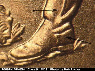 Die-stage B marker on 2009P•1DR•054 (2009 Doubled Die Reverse).