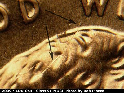 Die-stage B marker on 2009P•1DR•054 (2009 Doubled Die Reverse).