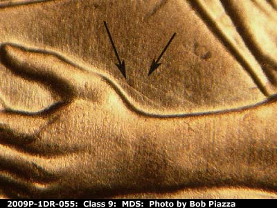 Die-stage B marker on 2009P•1DR•055 (2009 Doubled Die Reverse).