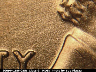 Die-stage B marker on 2009P•1DR•055 (2009 Doubled Die Reverse).