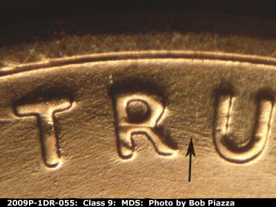 Die-stage B marker on 2009P•1DR•055 (2009 Doubled Die Reverse).